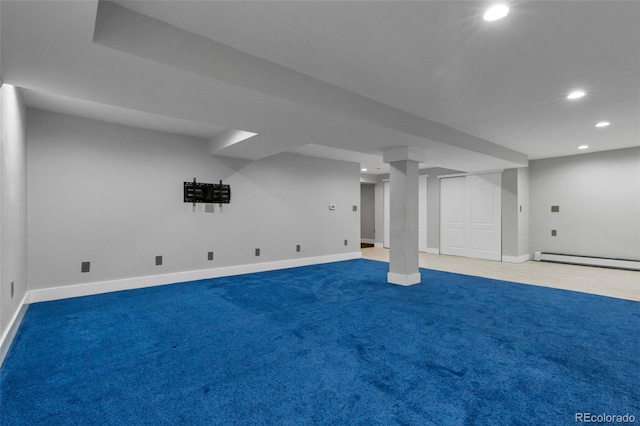 basement with carpet flooring and a baseboard radiator