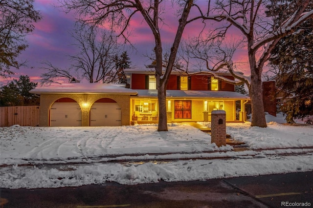 view of front facade featuring covered porch and a garage