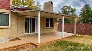 rear view of property with a patio area