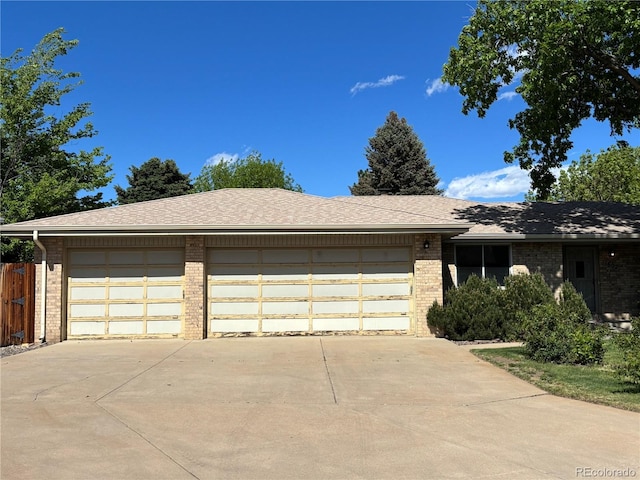 1602 S Lamar St, Lakewood, CO 80232 - single story home featuring brick siding, driveway, and a garage