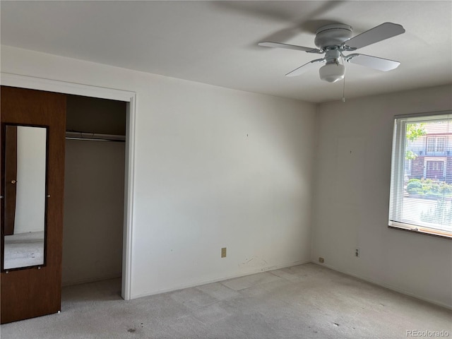 1602 S Lamar St, Lakewood, CO 80232 - unfurnished bedroom featuring light carpet, a closet, and a ceiling fan