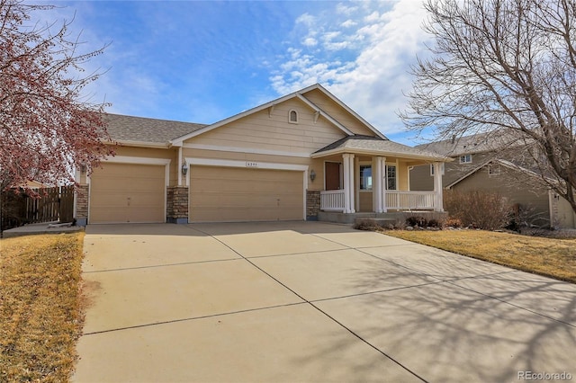 view of front of house with a front lawn, fence, covered porch, driveway, and an attached garage