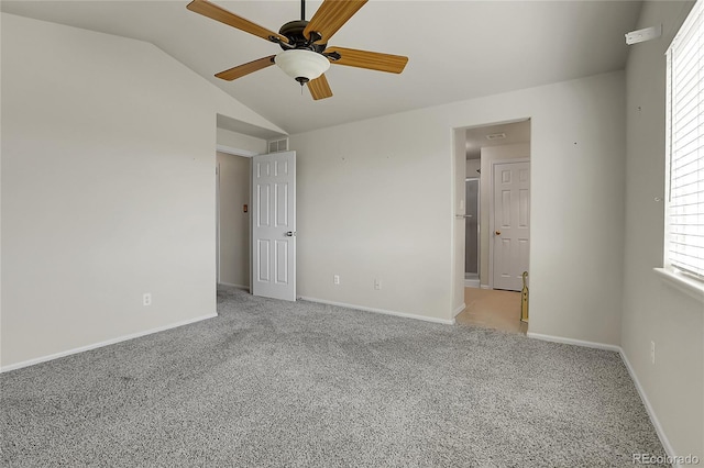 unfurnished bedroom featuring lofted ceiling, light colored carpet, baseboards, and ceiling fan