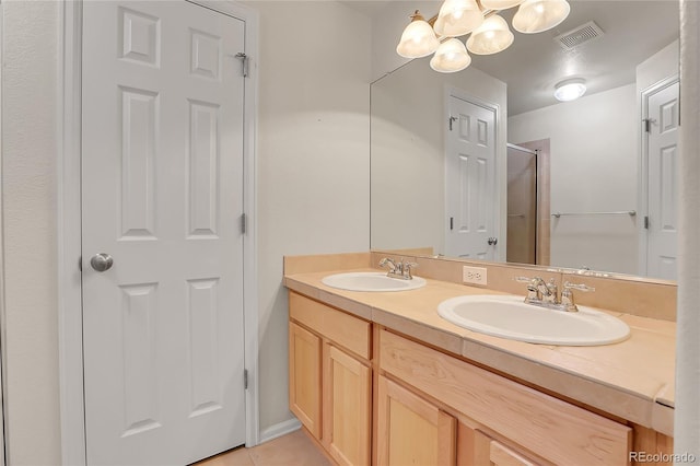 full bathroom featuring a sink, visible vents, a shower with shower door, and double vanity