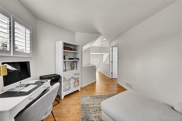 home office featuring recessed lighting, baseboards, visible vents, and light wood-style flooring