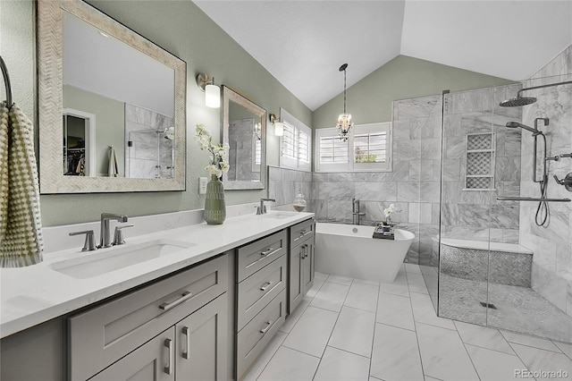 bathroom featuring a sink, a freestanding tub, vaulted ceiling, and tiled shower