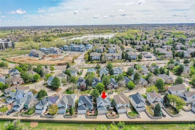 birds eye view of property featuring a residential view and a water view