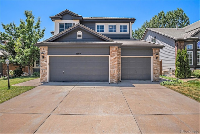 5569 S Helena St, Centennial, CO 80015 - view of front of property with brick siding, driveway, and a garage