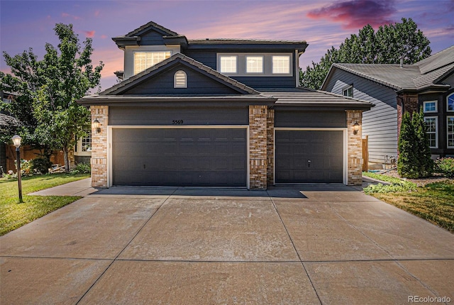 5569 S Helena St, Centennial, CO 80015 - traditional-style home featuring concrete driveway, brick siding, and an attached garage