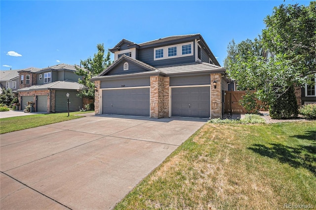 5569 S Helena St, Centennial, CO 80015 - view of front of property with brick siding, driveway, and an attached garage