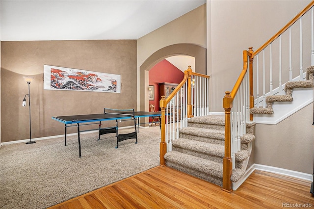 5569 S Helena St, Centennial, CO 80015 - recreation room with arched walkways and wood finished floors