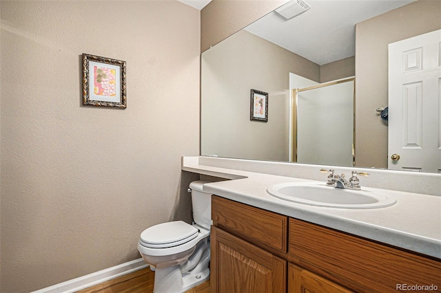 5569 S Helena St, Centennial, CO 80015 - full bath featuring vanity, wood finished floors, and a shower with shower door
