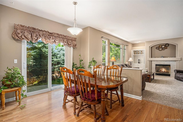 5569 S Helena St, Centennial, CO 80015 - dining area featuring light wood finished floors and a tile fireplace