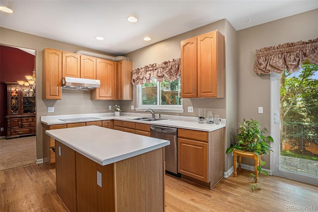 5569 S Helena St, Centennial, CO 80015 - kitchen featuring stainless steel dishwasher, under cabinet range hood, light countertops, light wood-type flooring, and electric cooktop