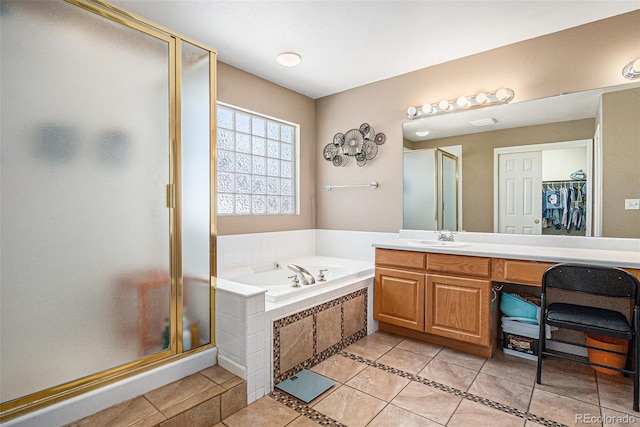 5569 S Helena St, Centennial, CO 80015 - full bath with tile patterned floors, a stall shower, vanity, and a bath