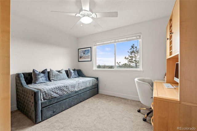 carpeted bedroom with baseboards and a ceiling fan