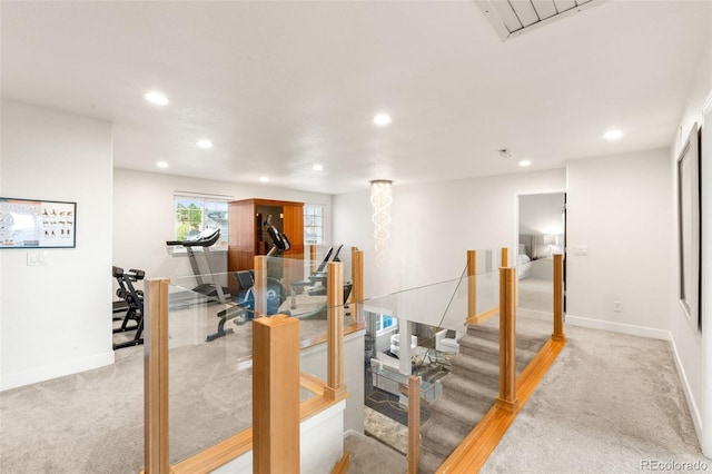 workout room with recessed lighting, baseboards, and light colored carpet
