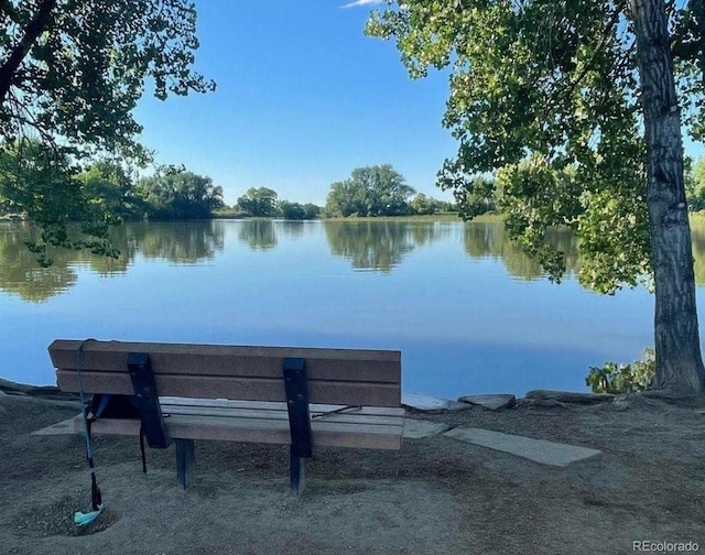 surrounding community with a water view