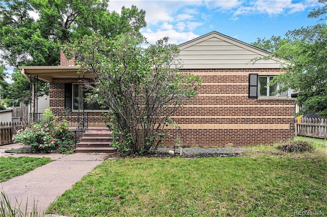 2526 W 39th Ave, Denver, CO 80211 - view of front facade with a porch, brick siding, and a chimney