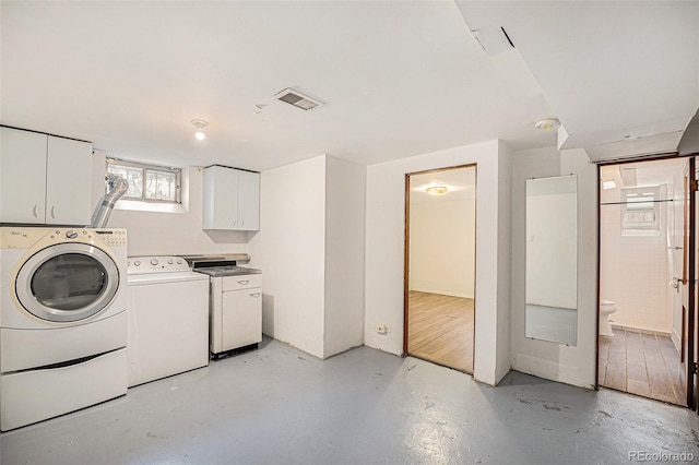 2526 W 39th Ave, Denver, CO 80211 - washroom featuring washing machine and clothes dryer and cabinet space
