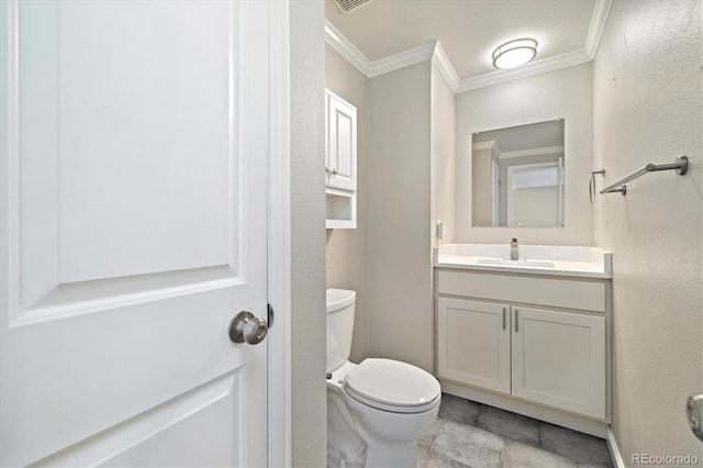 half bathroom with vanity, crown molding, and toilet