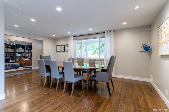 dining area with dark wood-type flooring