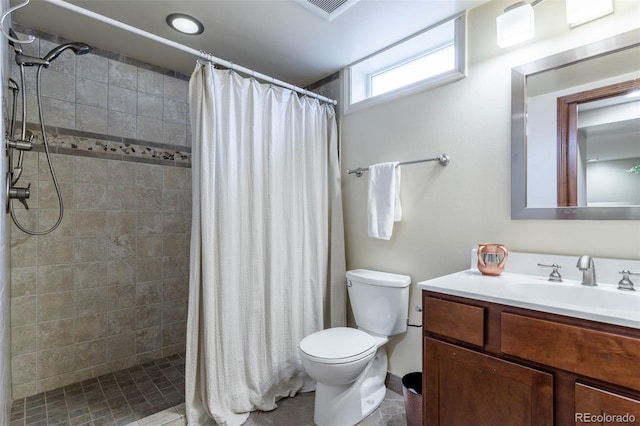 bathroom featuring vanity, toilet, and a shower with curtain