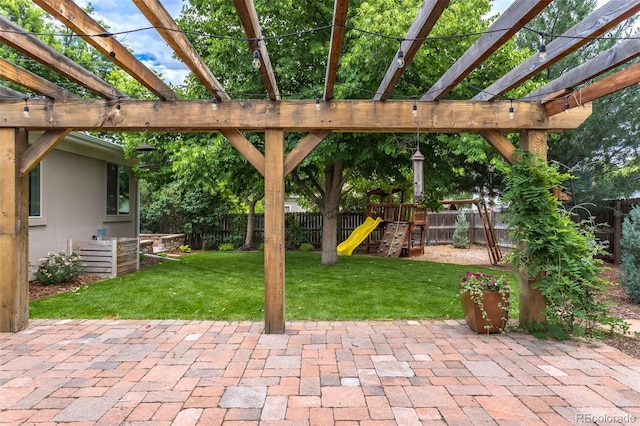 view of patio with a pergola and a playground