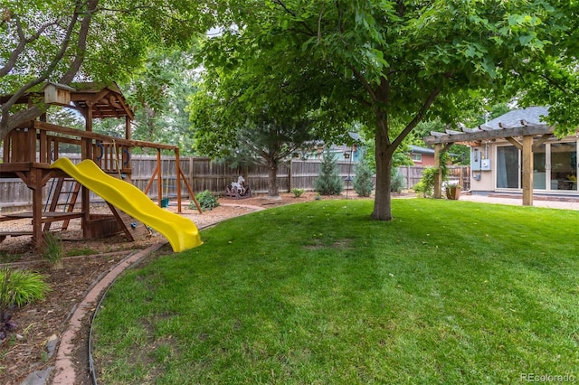 view of yard with a playground and a pergola