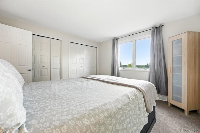 7830 Club Crest Dr, Arvada, CO 80005 - bedroom with multiple closets and carpet flooring