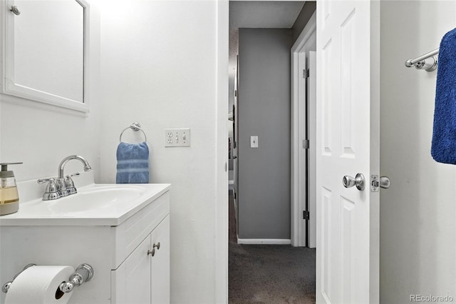 7830 Club Crest Dr, Arvada, CO 80005 - bathroom with vanity and baseboards