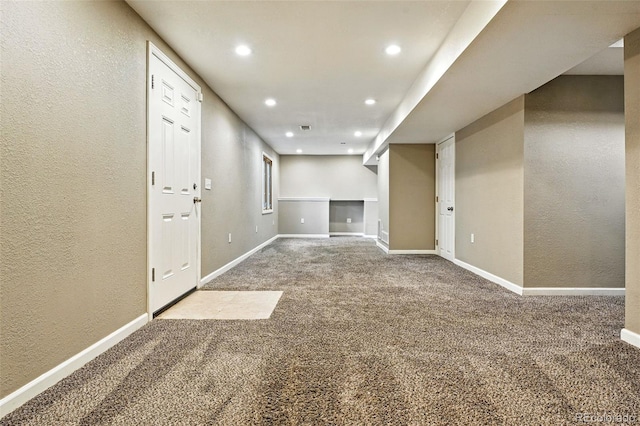 7830 Club Crest Dr, Arvada, CO 80005 - finished basement with carpet floors, recessed lighting, and a textured wall