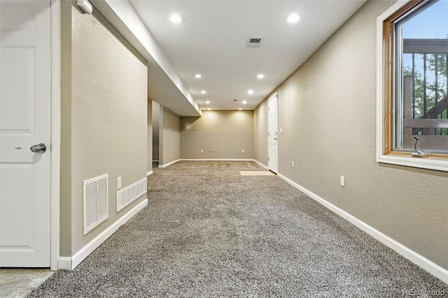 7830 Club Crest Dr, Arvada, CO 80005 - basement featuring carpet flooring, a textured wall, and recessed lighting