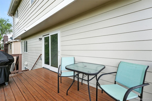 7830 Club Crest Dr, Arvada, CO 80005 - deck with outdoor dining area and a grill
