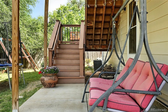 7830 Club Crest Dr, Arvada, CO 80005 - view of patio with stairway and a trampoline