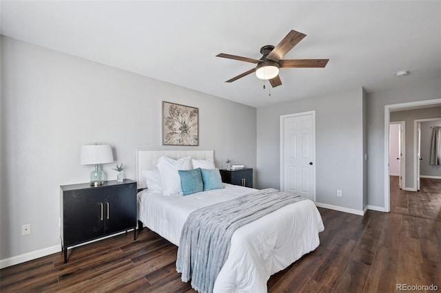 bedroom with a ceiling fan, baseboards, and wood finished floors