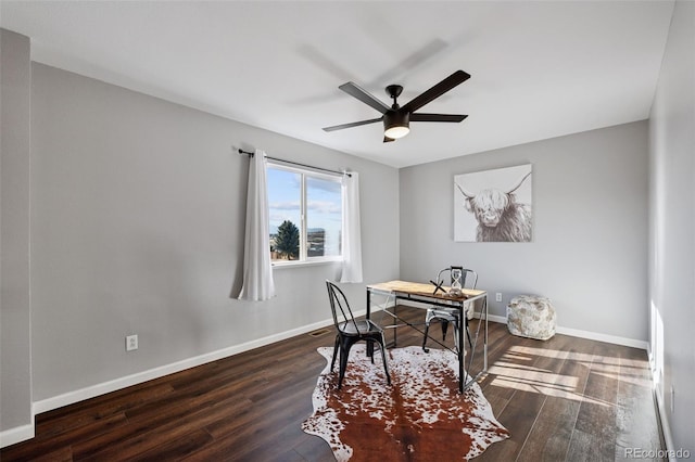 office area featuring ceiling fan, baseboards, and wood finished floors