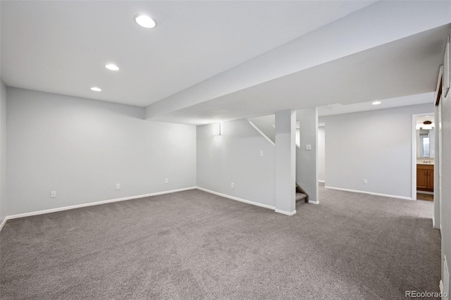 finished basement with recessed lighting, carpet flooring, stairway, and baseboards