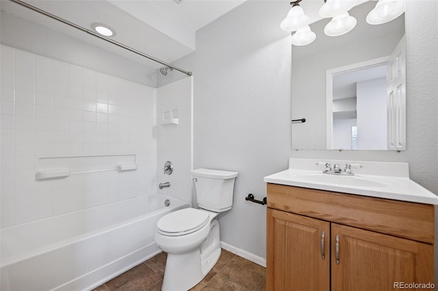 bathroom with bathing tub / shower combination, toilet, vanity, tile patterned flooring, and baseboards