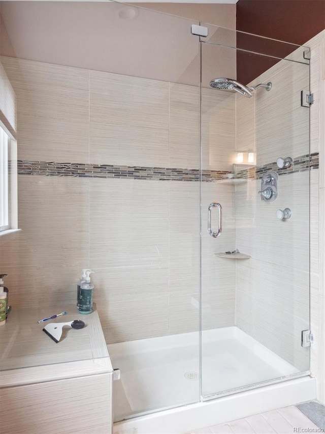 bathroom with a shower stall