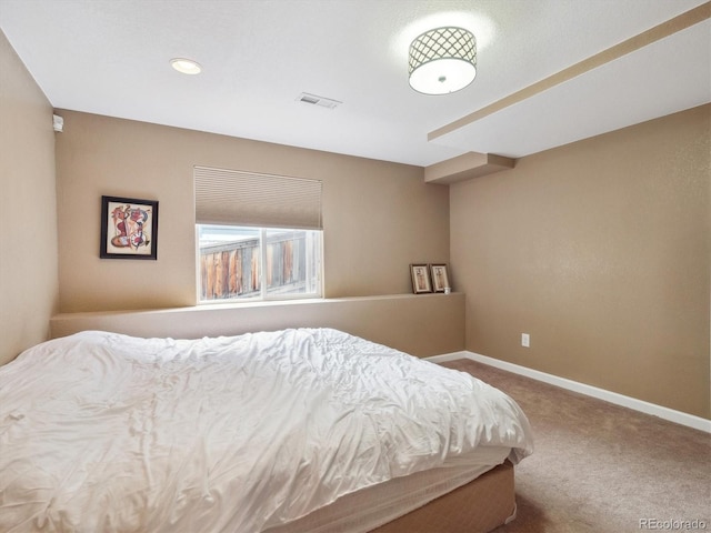 carpeted bedroom with baseboards, recessed lighting, and visible vents