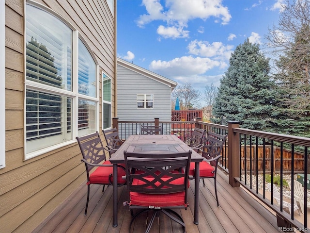 wooden deck with outdoor dining space