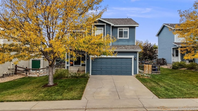 view of front of property with a front yard and a garage