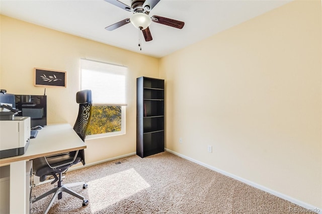 carpeted office with ceiling fan