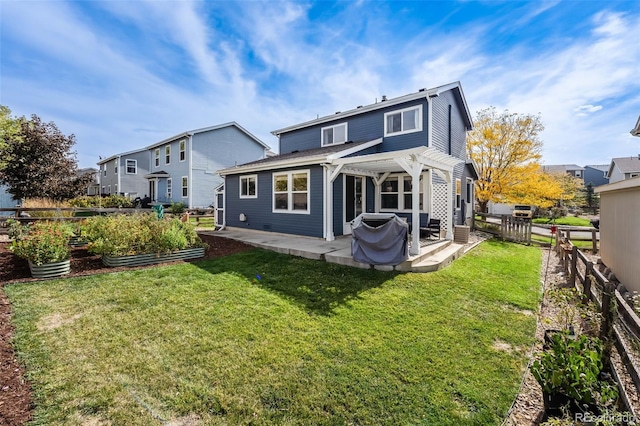 rear view of house featuring a pergola, a patio, and a lawn