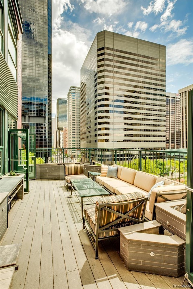 wooden deck featuring outdoor lounge area