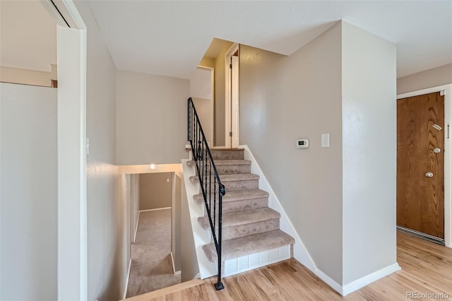 staircase featuring hardwood / wood-style floors