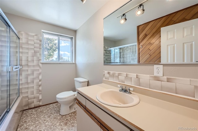 full bathroom with toilet, vanity, shower / bathtub combination with curtain, and tile patterned floors