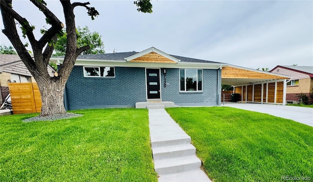 7126 Joan St, Denver, CO 80221 - view of front of house with concrete driveway, a carport, brick siding, and a shingled roof