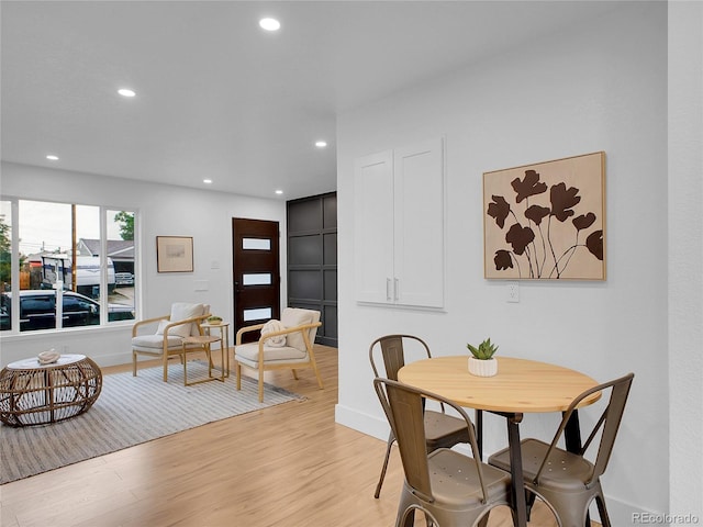 7126 Joan St, Denver, CO 80221 - dining space featuring light wood-type flooring, recessed lighting, and baseboards